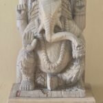 Kaashtha Ganapati — Carved Wood Ganesha (Warm teak with gold sacred detail)